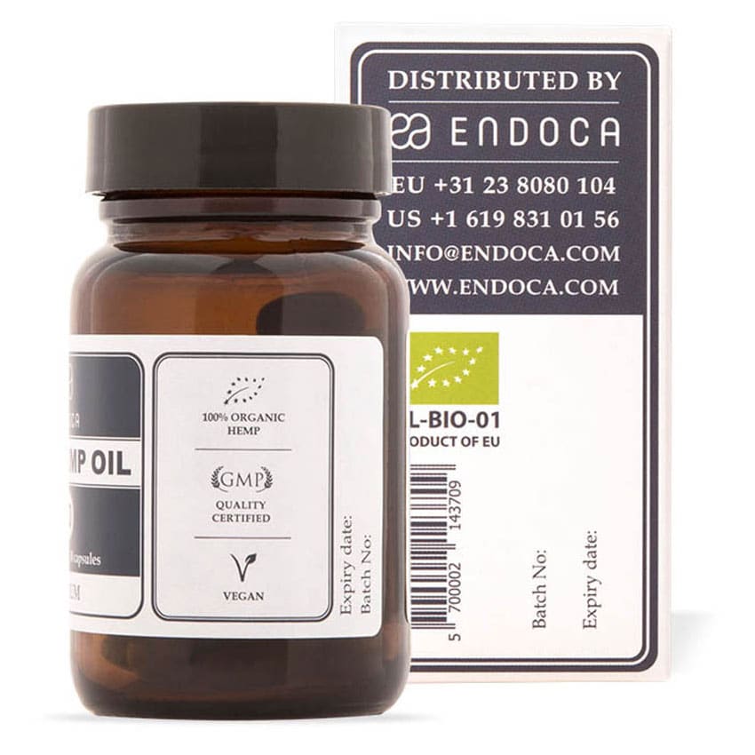 een flesje cbd olie naast een doosje cbd olie. miniatuur