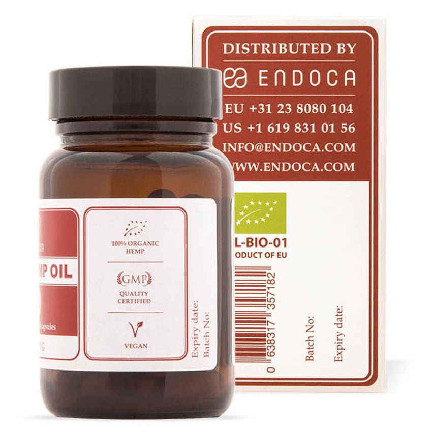 een flesje cbd olie naast een doosje cbd olie. miniatuur